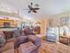 Inviting living room featuring hardwood floors, a ceiling fan, comfortable seating, and an open layout at 85 Long Meadow Ct, Rotonda West, FL 33947
