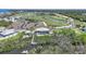 Tranquil waterfront home with golf course views, private dock, and lush landscaping at 10161 Eagle Preserve Dr, Englewood, FL 34224