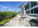 Pathway lined with lush greenery and well-manicured landscaping leading to the home at 10161 Eagle Preserve Dr, Englewood, FL 34224