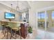Entertainers dream! A full bar area featuring marble countertops and plenty of beverage storage at 10161 Eagle Preserve Dr, Englewood, FL 34224