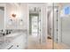 Bright bathroom featuring granite countertops, double sinks, and access to walk-in shower at 10161 Eagle Preserve Dr, Englewood, FL 34224