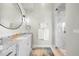 Modern bathroom with glass shower, granite counters, and updated fixtures at 10161 Eagle Preserve Dr, Englewood, FL 34224