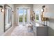Vanity area with modern mirror, soft lighting, and balcony view at 10161 Eagle Preserve Dr, Englewood, FL 34224