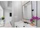 Elegant bathroom with a modern vanity, marble backsplash, and stylish fixtures at 10161 Eagle Preserve Dr, Englewood, FL 34224