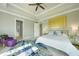 Bright bedroom featuring a ceiling fan, natural light, and a calming color palette at 10161 Eagle Preserve Dr, Englewood, FL 34224