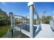 Durable metal boat lift providing safe harbor for your boat, with view of property on canal at 10161 Eagle Preserve Dr, Englewood, FL 34224
