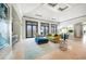 Bright living room features high ceilings, stone floors, and stylish decor at 10161 Eagle Preserve Dr, Englewood, FL 34224