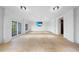 Spacious living room with tile flooring, recessed lighting, and access to the outdoors at 10161 Eagle Preserve Dr, Englewood, FL 34224