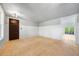Bright living area features paneled walls and tile floors, creating a welcoming and stylish atmosphere at 10161 Eagle Preserve Dr, Englewood, FL 34224
