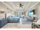 Relaxing main bedroom with neutral colors, TV, and sunny balcony access at 10161 Eagle Preserve Dr, Englewood, FL 34224