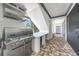 Modern outdoor grill featuring stainless steel appliances and granite countertops at 10161 Eagle Preserve Dr, Englewood, FL 34224