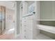 Bright walk-in closet features built in shelves and draws as well as access to bathroom at 10161 Eagle Preserve Dr, Englewood, FL 34224