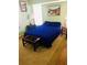 Cozy bedroom featuring hardwood floors, a comfortable bed, and stylish decor at 1017 Guild St, Port Charlotte, FL 33952