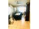 Formal dining room featuring tile flooring, ceiling fan, and natural light at 1017 Guild St, Port Charlotte, FL 33952