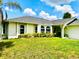 Charming single-story home with well-maintained lawn and freshly trimmed landscaping at 1017 Guild St, Port Charlotte, FL 33952