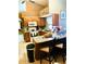Eat-in kitchen boasting granite countertops, tile flooring, and stainless-steel appliances at 1017 Guild St, Port Charlotte, FL 33952