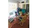 Relaxing sunroom overlooking the pool area with comfortable seating and glass table at 1017 Guild St, Port Charlotte, FL 33952