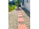 Exterior shot of stone walkway and decorative stone adjacent to the home at 1017 Guild St, Port Charlotte, FL 33952