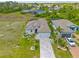 Beautiful single Gathering home with manicured landscaping and a brick paved driveway at 111 Britt Rd, Rotonda West, FL 33947