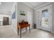 Elegant foyer featuring a stylish desk, decorative accents, and a bright, welcoming entrance at 111 Britt Rd, Rotonda West, FL 33947