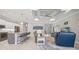 Spacious living room with an open concept design, seamlessly connected to the kitchen and dining areas at 111 Britt Rd, Rotonda West, FL 33947