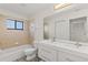 Stylish bathroom with double sink vanity, large mirror, and combination tub and shower at 118 Naomi Pl, Rotonda West, FL 33947