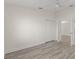 A spacious bedroom with wood-look flooring, ceiling fan and walk-in closet at 118 Naomi Pl, Rotonda West, FL 33947