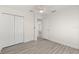 Neutral bedroom with ceiling fan, closet space, and modern flooring at 118 Naomi Pl, Rotonda West, FL 33947