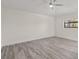 Spacious and light bedroom featuring a ceiling fan and large window at 118 Naomi Pl, Rotonda West, FL 33947