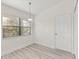 Bright bedroom featuring a window with blinds and overhead lighting at 118 Naomi Pl, Rotonda West, FL 33947