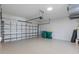 Spacious garage with a secure door, and ample space for vehicles and storage at 118 Naomi Pl, Rotonda West, FL 33947