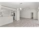 Spacious living room with laminate flooring and an open floor plan to kitchen at 118 Naomi Pl, Rotonda West, FL 33947