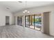 Bright room with seamless access to screened patio with pool view at 118 Naomi Pl, Rotonda West, FL 33947