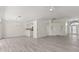 Open living room featuring modern floors and neutral tones, bright and airy at 118 Naomi Pl, Rotonda West, FL 33947