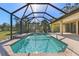 Sparkling pool in a screened enclosure, surrounded by lush greenery and a serene atmosphere at 118 Naomi Pl, Rotonda West, FL 33947