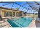 Sparkling swimming pool with a screened enclosure, perfect for relaxation and entertainment at 118 Naomi Pl, Rotonda West, FL 33947
