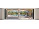 Covered screened patio overlooking a sparkling pool and lush landscaping at 118 Naomi Pl, Rotonda West, FL 33947