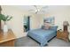 Cozy bedroom with a boat painting, plush carpeting, and a large window for natural light at 12185 Weimar Ave, Port Charlotte, FL 33981