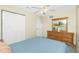 Bedroom featuring a large closet, ceiling fan, and neutral color scheme for relaxation at 12185 Weimar Ave, Port Charlotte, FL 33981