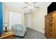 Bedroom featuring neutral walls and carpeting, a ceiling fan, and closet at 12185 Weimar Ave, Port Charlotte, FL 33981