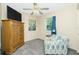 Bedroom featuring a large wood dresser, window, and ceiling fan at 12185 Weimar Ave, Port Charlotte, FL 33981