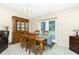 Charming dining space with backyard views and convenient access to the adjacent kitchen at 12185 Weimar Ave, Port Charlotte, FL 33981