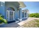 Inviting front door showcasing the home's charming architectural details and address at 12185 Weimar Ave, Port Charlotte, FL 33981
