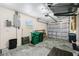 A bright garage area featuring ample storage space with multiple trash and recycle bins at 12185 Weimar Ave, Port Charlotte, FL 33981