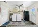 Laundry room featuring a washer, dryer, refrigerator, and ample storage space at 12185 Weimar Ave, Port Charlotte, FL 33981