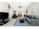 Spacious living room features vaulted ceilings, tile floors, and ample natural light at 12185 Weimar Ave, Port Charlotte, FL 33981