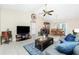 Open-concept living space includes a dining area with access to outdoor patio at 12185 Weimar Ave, Port Charlotte, FL 33981