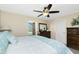 Calm main bedroom with a ceiling fan, large window with natural light, and neutral colors at 12185 Weimar Ave, Port Charlotte, FL 33981