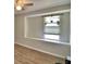 Bright bedroom featuring modern ceiling fan and window alcove with plants at 13495 Newport Ave, Port Charlotte, FL 33981