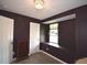 This bedroom has modern paint and trim, updated floors and a charming window seat at 13495 Newport Ave, Port Charlotte, FL 33981